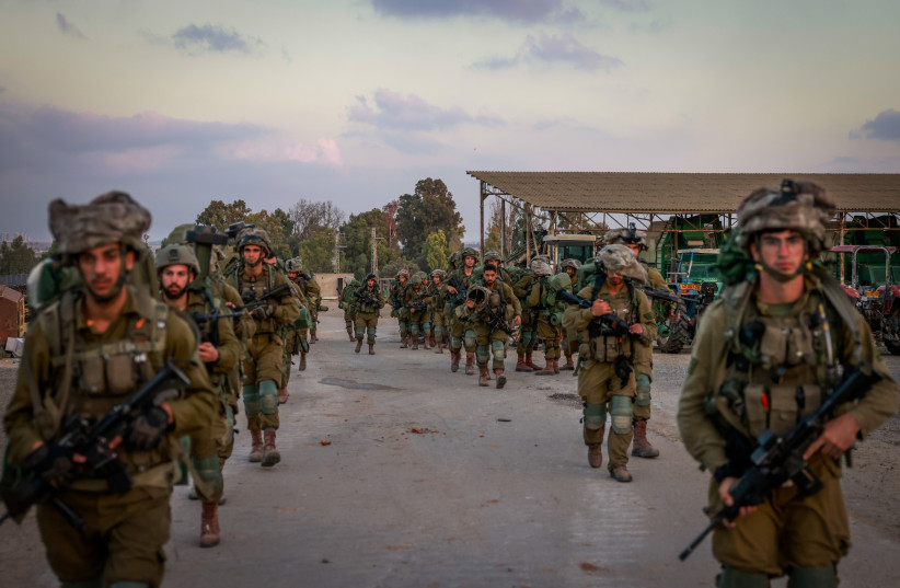  Israeli soldiers seen in Kibbutz Be'eri, near the Israeli-Gaza border, in southern Israel, October 11, 2023. (credit: Chaim Goldberg/Flash90)