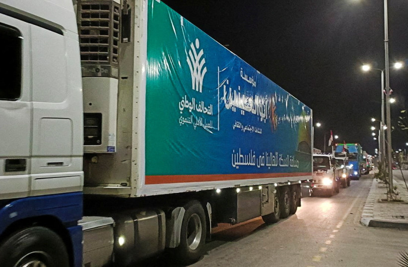  A convoy of trucks carrying humanitarian aid from Egyptian NGOs for Palestinians start to move from Al-Arish to Rafah city as they wait for an agreement on the opening on the Rafah border crossing to enter Gaza, amid the ongoing conflict between Israel and Hamas, in the city of Al-Arish. (credit: REUTERS/STRINGER)