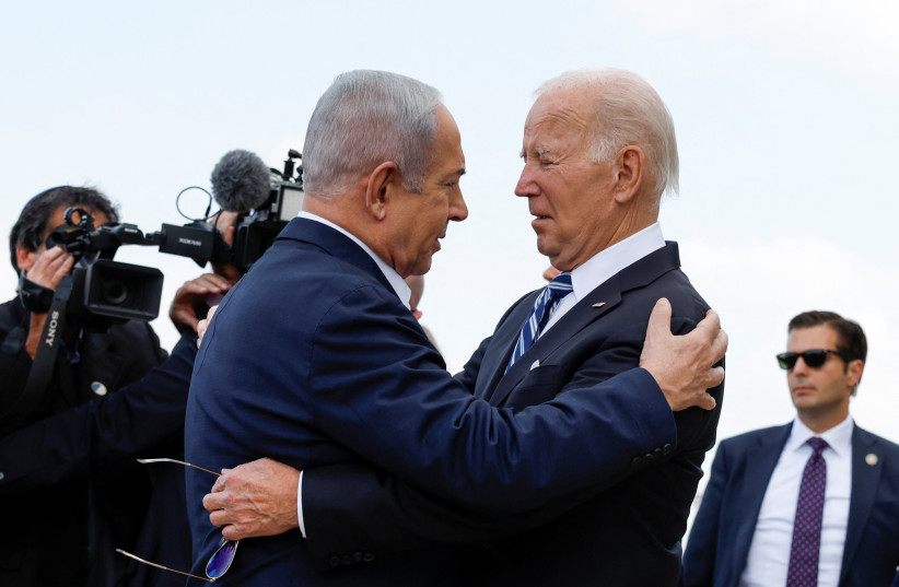  US President Joe Biden is welcomed by Israeli Prime Minster Benjamin Netanyahu, as he visits Israel amid the ongoing conflict between Israel and Hamas, in Tel Aviv, Israel, October 18, 2023 (credit: REUTERS/EVELYN HOCKSTEIN)