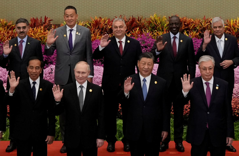  Indonesian President Joko Widodo, Russian President Vladimir Putin, Chinese President Xi Jinping, Kazakhstan President Kassym-Jomart Tokayev with other leaders wave for a group photo at the Third Belt and Road Forum at the Great Hall of the People in Beijing, China, October 18, 2023. (credit: SUO TAKEKUMA/POOL VIA REUTERS)
