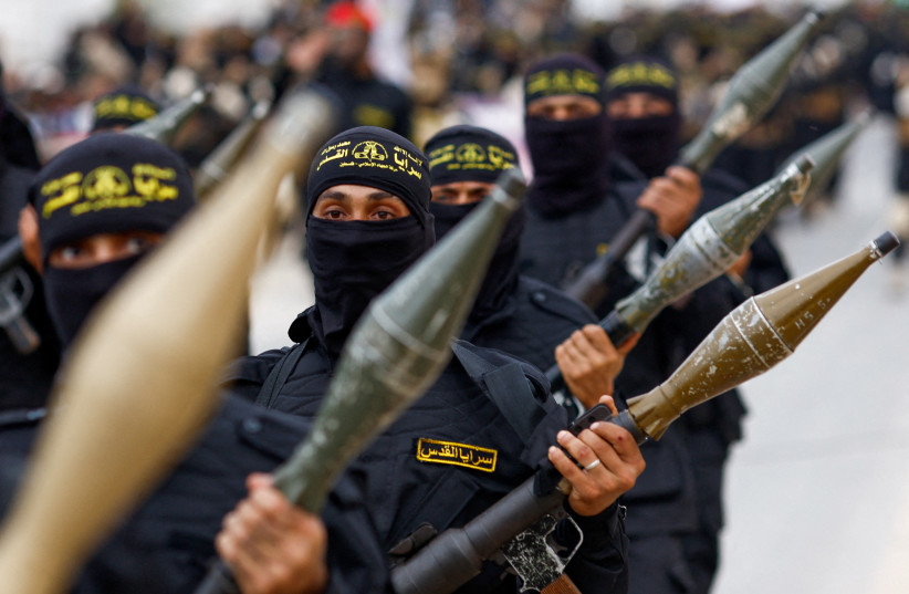  Palestinian Islamic Jihad terrorists participate in an anti-Israel military parade marking the 36th anniversary of the movement's foundation in Gaza City, October 4, 2023. (credit: MOHAMMED SALEM/REUTERS)