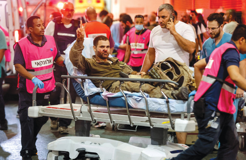 A wounded Israeli officer arrives at a hospital in Ashkelon on October 7.