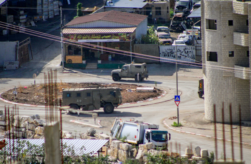  Israeli army vehicles seen during a military raid in the West Bank city of Tulkarm, in the West Bank on October 19, 2023. (credit: NASSER ISHTAYEH/FLASH90)