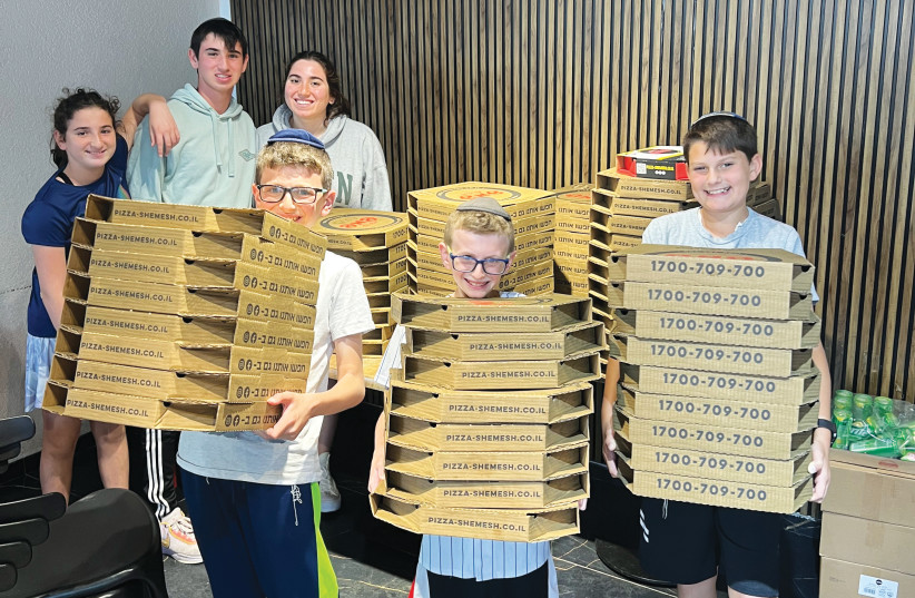  PIZZAS FOR wives of reserve soldiers, delivered by youth from Efrat’s Zayit neighborhood. (credit: Orit Seif)