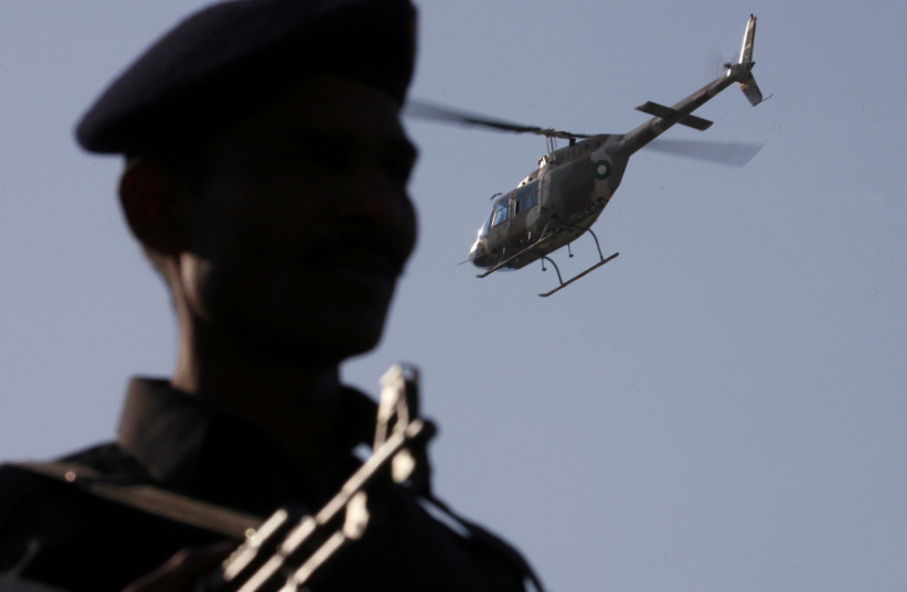  A paramilitary surveillance helicopter flies during a Shi'ite religious procession ahead of the Ashura festival in Karachi January 19, 2008. (credit: REUTERS/Zahid Hussein)