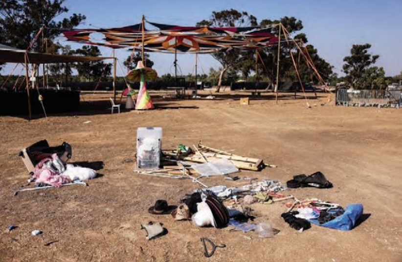  THE BELONGINGS of festivalgoers are seen at the site of the Supernova festival, at which Awad Darawshe was working when Hamas unleashed its massacre on October 7. (credit: RONEN ZVULUN/REUTERS)