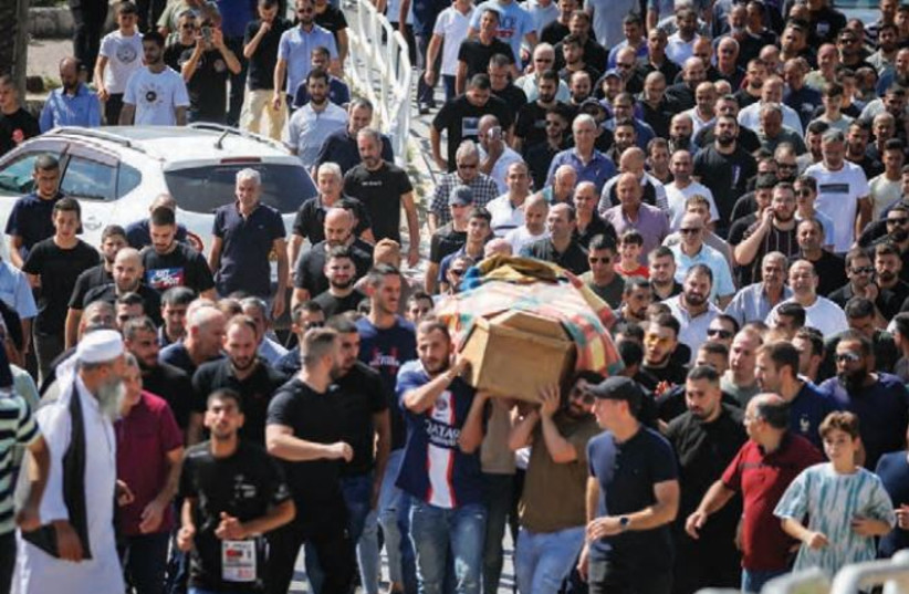  FAMILY AND friends attend the funeral of Majed Ibrahim, 19, who was killed when a rocket fired by Hamas hit his house in Abu Ghosh, outside of Jerusalem, last week. (credit: JAMAL AWAD/FLASH90)