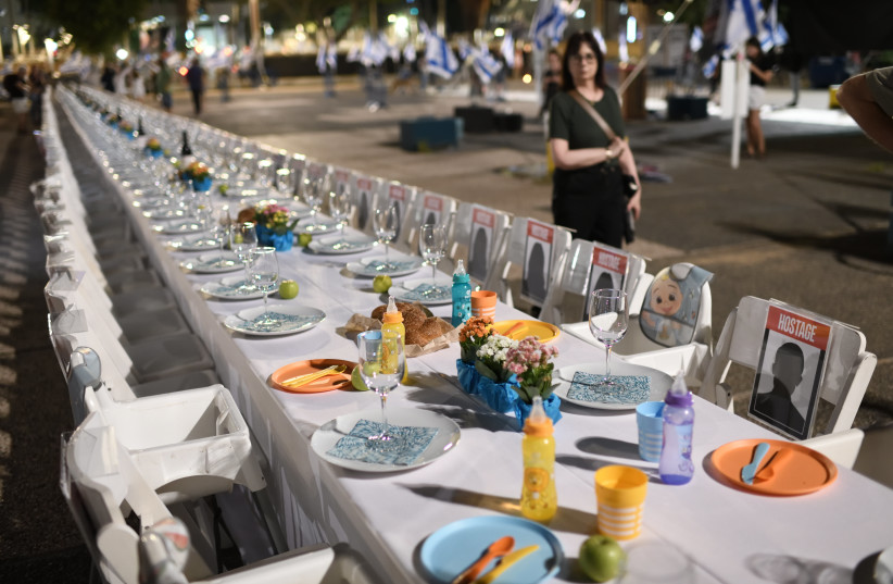  Families of Israelis held hostage by Hamas militants in Gaza set a Shabbat table with more than 200 empty seats for the hostages, at the ''Hostages Square'', outside the Art Museum of Tel Aviv, October 20, 2023. (credit: GILI YAARI /FLASH90)