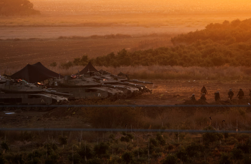  A formation of Israeli tanks is positioned near Israel's border with the Gaza Strip, in southern Israel October 21, 2023 (credit: REUTERS/VIOLETA SANTOS MOURA)