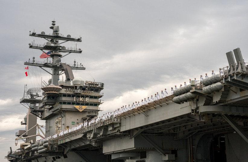  The U.S. Navy Nimitz-class aircraft carrier USS Dwight D. Eisenhower deploys from Naval Station Norfolk, Virginia, U.S. October 14, 2023. (credit: US Navy/Mass Communication Specialist 2nd Class Anderson W. Branch/Handout)