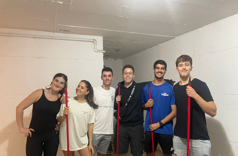  Volunteers work to clean up and renovate shelters in Israel's North, to prepare for a possible war with Hezbollah. (credit: JNF UK)