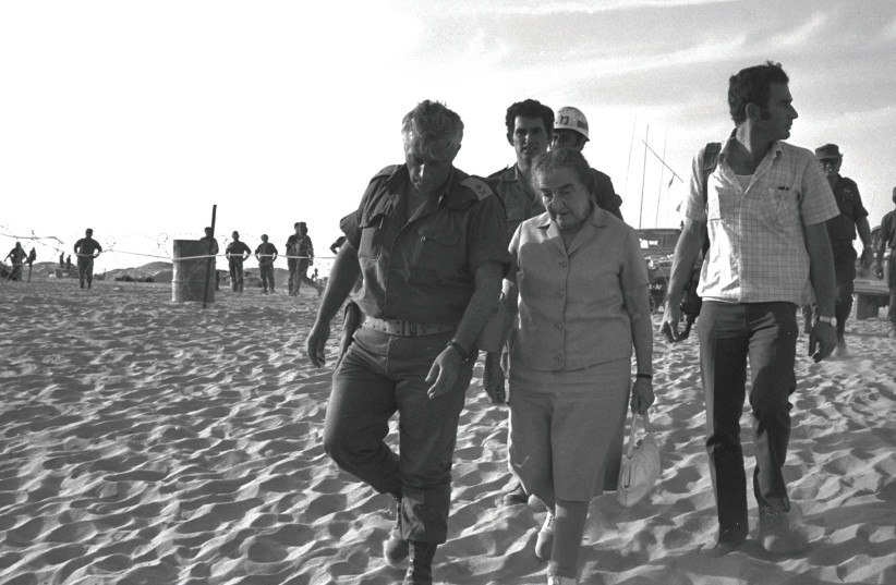 PRIME MINISTER Golda Meir with Maj. Gen. Ariel Sharon in the Sinai Peninsula in Oct. 1973.  (credit: Yehuda Tzion/GPO/Handout/Reuters)