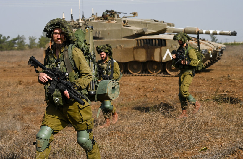 IDF reserve Infantry and Merkava Tank soldiers train in a military exercise in the Golan Heights on October 23, 2023 (credit: MICHAEL GILADI/FLASH90)