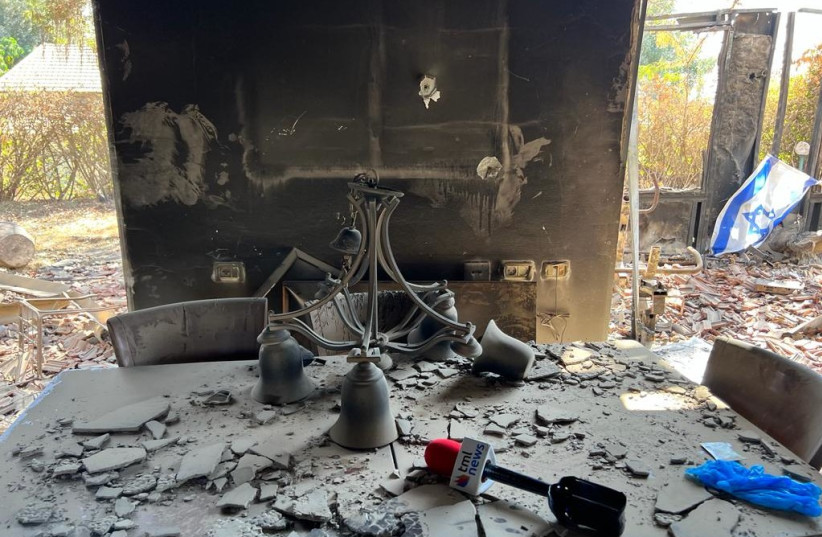  The dining room table of a destroyed home at Kibbutz Be'eri, Oct. 20, 2023. (credit: FELICE FRIEDSON/THE MEDIA LINE)