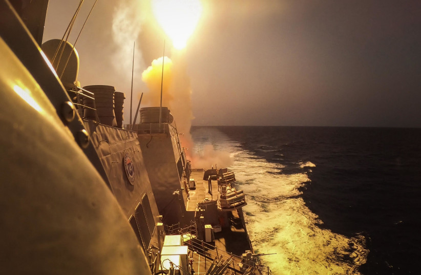  The Arleigh Burke-class guided-missile destroyer USS Carney (DDG 64) fires a Standard Missile (SM) 2 to defeat a combination of Houthi missiles and unmanned aerial vehicles in the Red Sea, Oct. 19, 2023. (credit: Mass Communication Specialist 2nd Class Aaron Lau/US Navy)