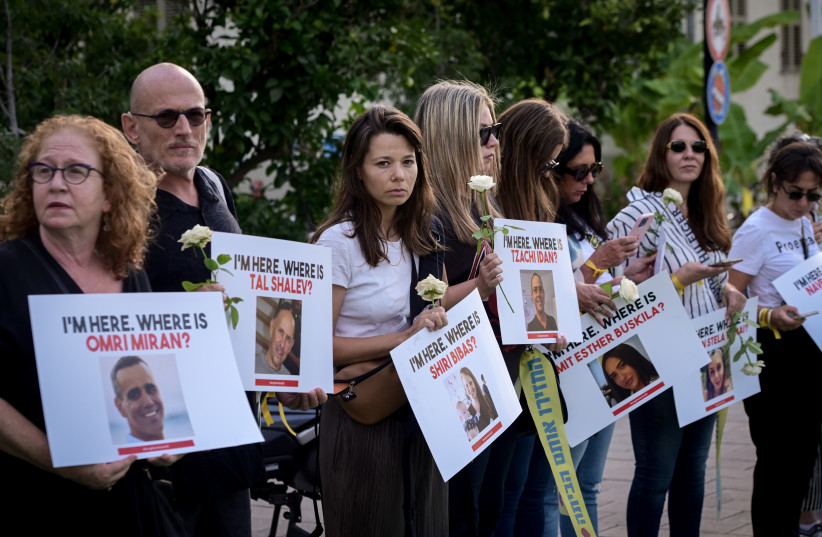  People call on the release of Israelis held hostage by Hamas militants in Gaza, outside the Ministry of Defense in Tel Aviv. October 19, 2023. (credit: AVSHALOM SASSONI/FLASH90)