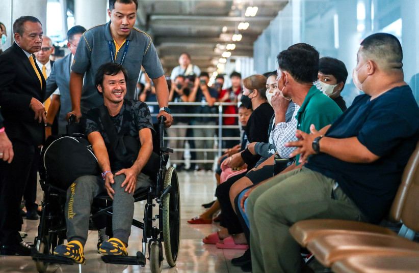  Katchakorn Pudtason, a migrant agricultural worker who was injured by a surprise attack on Israel by the Palestinian militant group Hamas, arrives after being repatriated from Israel at Bangkok's Suvarnabhumi Airport, Thailand, October 12, 2023.  (credit: REUTERS/Chalinee Thirasupa)