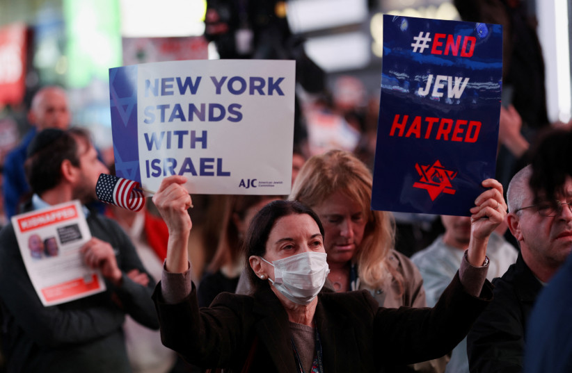  People attend a demonstration to express solidarity with Israel, amid the ongoing conflict between Israel and the Palestinian Islamist group Hamas, in New York City, U.S., October 19, 2023.  (credit: REUTERS/MIKE SEGAR)