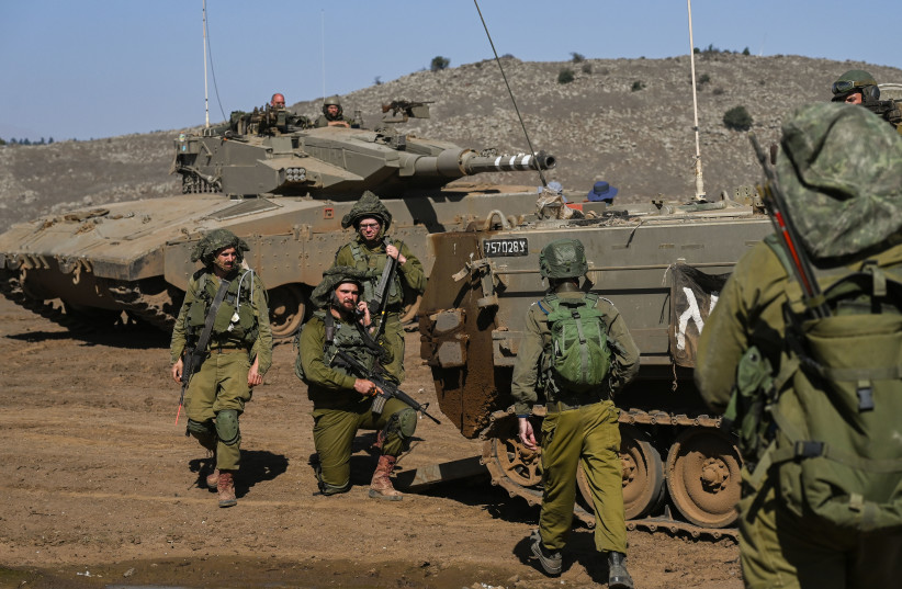 Israeli reserve soldiers seen during a military training before heading to the Israeli-Gaza border in the Golan Heights, northern Israel, on October 25, 2023 (credit: MICHAEL GILADI/FLASH90)