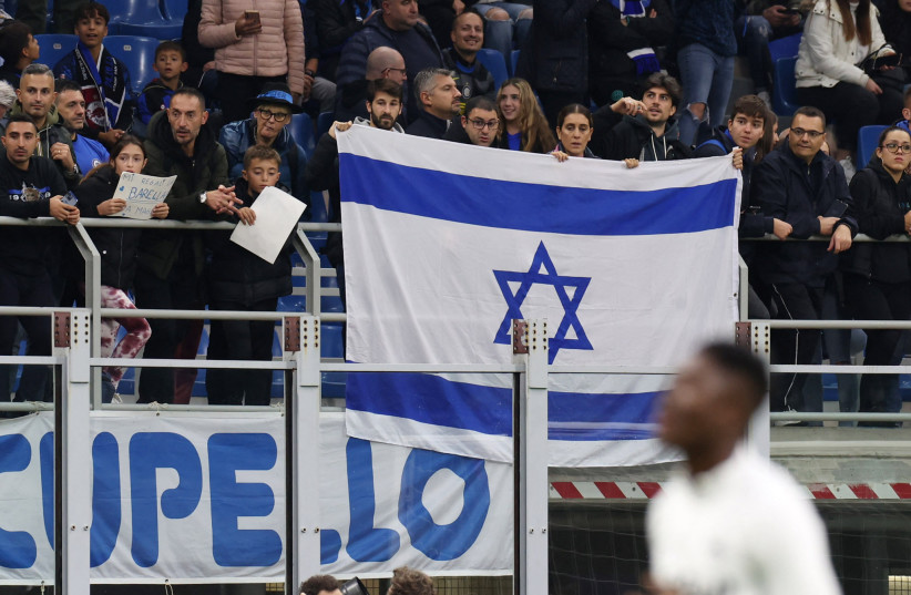  Inter Milan fans display an Israel flag inside the stadium before the match, October 24, 2023. (credit: REUTERS/CLAUDIA GRECO)