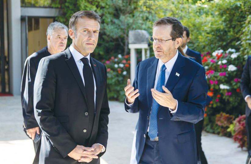  PRESIDENT ISAAC HERZOG makes a point to French President Emmanuel Macron at the President’s Residence in Jerusalem, October 2023 (credit: OREN BEN HAKOON/FLASH90)