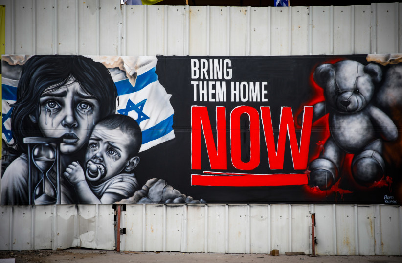  A graffiti for the release of  Israelis held hostage by Hamas terrorists in Gaza, in the northern Israeli city of Haifa, October 27, 2023 (credit: SHIR TOREM/FLASH90)