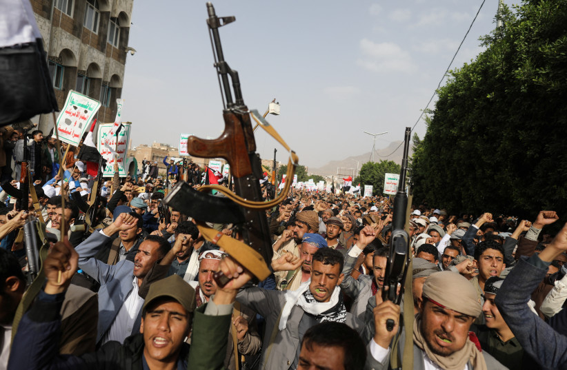  Armed men hold up their weapons as Houthi supporters rally to show support to Palestinian factions, in Sanaa, Yemen October 7, 2023 (credit: REUTERS/KHALED ABDULLAH)
