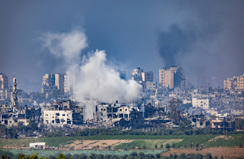  Smoke rises during Israeli airstrikes, in the Gaza Strip, as seen from the Israeli side of the border, on October 28, 2023 (credit: YONATAN SINDEL/FLASH90)