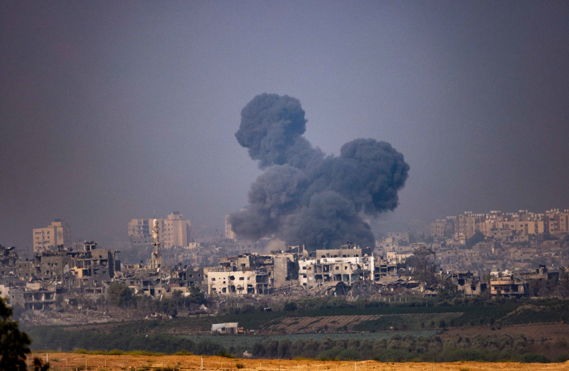  Smoke rises during Israeli airstrikes, in the Gaza Strip, as seen from the Israeli side of the border, on October 28, 2023 (credit: YONATAN SINDEL/FLASH90)