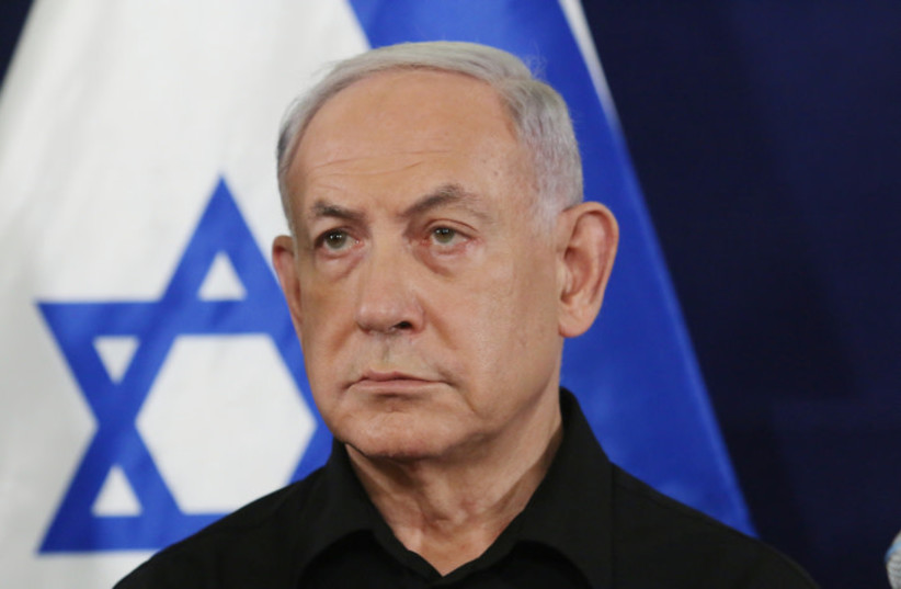  Israeli prime minister Benjamin Netanyahu speaks at a press conference at  the Ministry of Defense, in Tel Aviv. October 28, 2023 (credit: Dana Kopel/Pool)