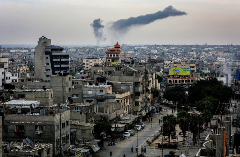  Smoke rising after an Israeli airstrike as it seen from Rafah, in the southern Gaza Strip, on October 27, 2023 (credit: ABED RAHIM KHATIB/FLASH90)