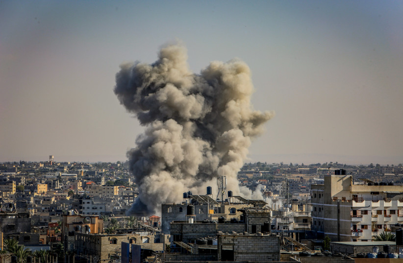  Smoke rising after an Israeli airstrike as it seen from Rafah, in the southern Gaza Strip, on October 25, 2023. (credit: ABED RAHIM KHATIB/FLASH90)