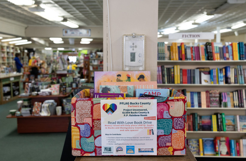  Books that have been donated to the ''Read with Love Book Drive'' run by PFLAG Bucks County to help place LGBTQ+ books in Bucks and Montgomery County libraries are placed in a donation box at the Doylestown Bookshop in Doylestown, Pennsylvania, U.S., April 7, 2023. (credit: REUTERS/HANNAH BEIER)