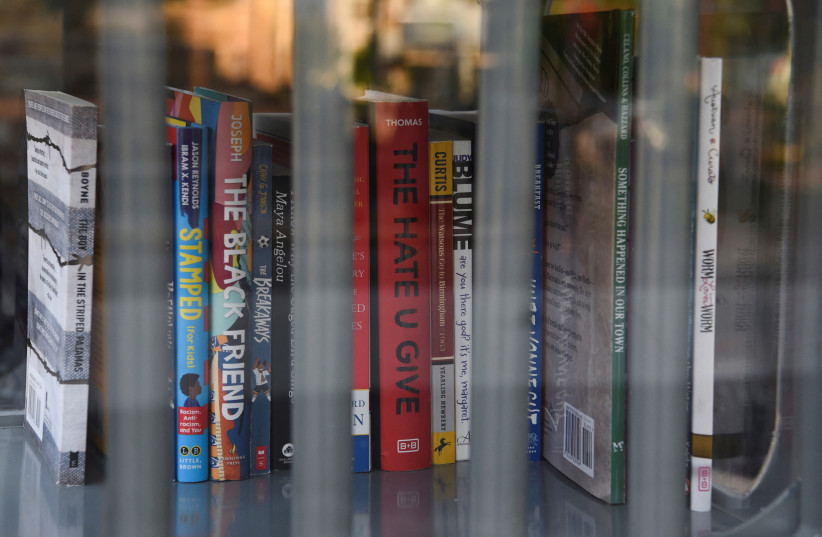  A Little Free Library, which was designed to look like a prison, invites residents to take books that the library says have been challenged by schools across the state of Texas, in Houston, Texas, U.S. May 3, 2023. (credit: REUTERS/CALLAGHAN O'HARE)