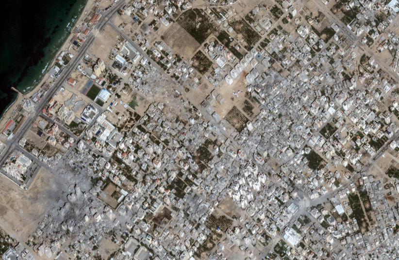  Satellite view shows damaged areas in Al-Karama, due to the ongoing conflict between Israel and Hamas, Gaza Strip, October 21, 2023 (credit: MAXAR TECHNOLOGIES/HANDOUT VIA REUTERS)