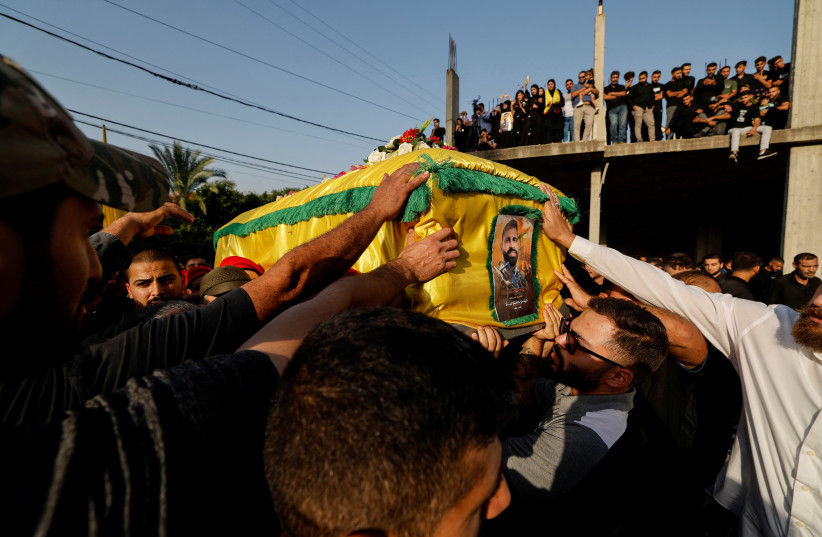  People carry the coffin of Hezbollah member Haydar Ayad, who was killed in southern Lebanon amidst tension between Israel and Hezbollah, during his funeral, in Babliyeh Lebanon, October 24, 2023. (credit: REUTERS/ZOHRA BENSEMRA)