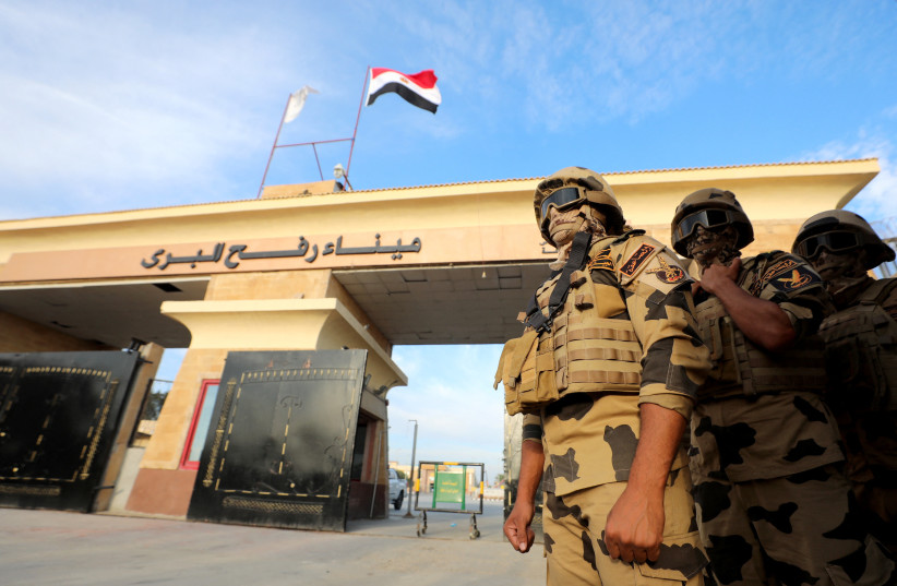 Military personnel stand guard on the day of Egyptian Prime Minister Mostafa Madbouly's visit to the Rafah border crossing between Egypt and the Gaza Strip, amid the ongoing conflict between Israel and Palestinian Islamist group Hamas, in Rafah, Egypt, October 31, 2023. (credit: REUTERS/MOHAMED ABD EL GHANY)