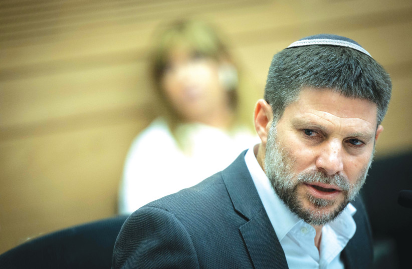  FINANCE MINISTER Bezalel Smotrich attends a discussion on the state budget, at the Knesset Finance Committee, in July. The state budget for 2024 and the next few years must be fundamentally redrafted, say the writers.  (credit: YONATAN SINDEL/FLASH 90)