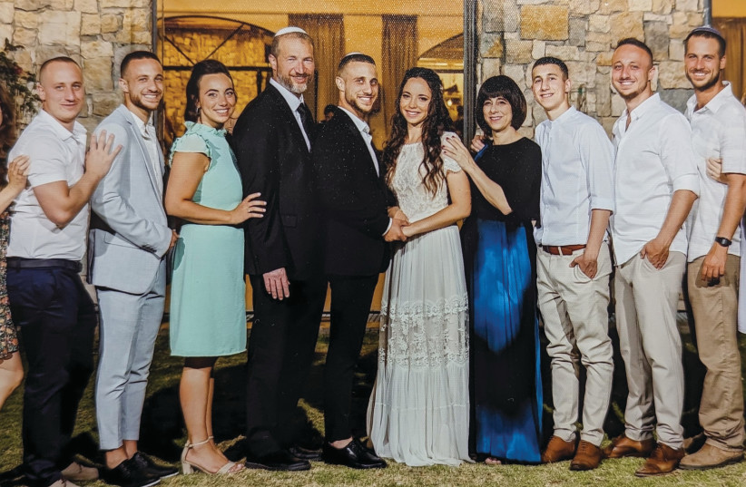  THE SLOTKI family at Yishai and Avia’s wedding: (L to R) Adi and Noam, Yonatan, Shifra, Rabbi Shmuel, Yishai and Avia, Tali, Tzviki, Aviah, Auri, and Shir. (credit: Photos: Courtesy Slotki family)