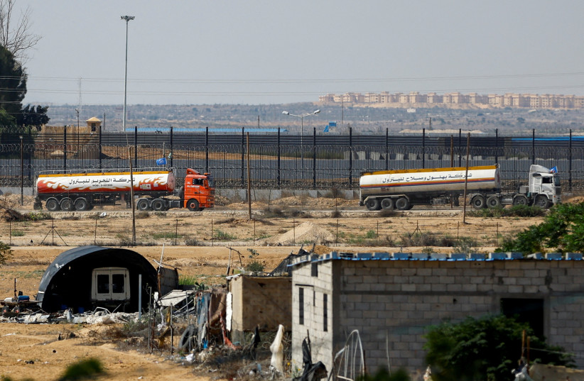  UN-flagged fuel trucks move towards the border crossing, amid the ongoing Israeli-Palestinian conflict, in Rafah in the southern Gaza Strip, October 16, 2023 (credit:  REUTERS/Ibraheem Abu Mustafa)
