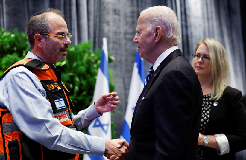  U.S. President Joe Biden shakes hands with Eli Beer, during a meeting with Israeli first responders, family members and other citizens directly impacted by the October 7th attack on Israel by Hamas, in Tel Aviv, Israel, October 18, 2023.  (credit: REUTERS/EVELYN HOCKSTEIN)