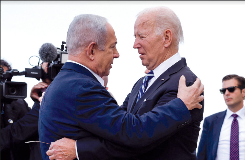  US President Joe Biden embraces Prime Minister Benjamin Netanyahu in Tel Aviv on October 18 (credit: EVELYN HOCKSTEIN/REUTERS)