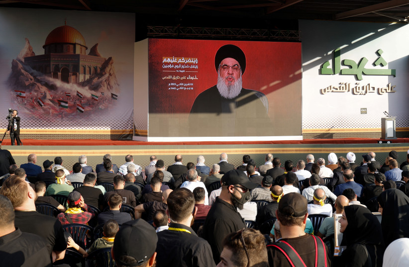  Supporters of Lebanon's Hezbollah leader Sayyed Hassan Nasrallah gather to watch his address during a ceremony to honour fighters killed in the recent escalation with Israel, in Beirut's southern suburbs, Lebanon November 3, 2023 (credit: REUTERS/ALAA AL-MARJANI)