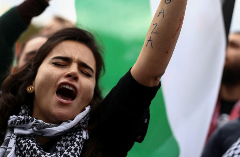 A protestor gestures during a pro-Palestinian demonstration, amid the ongoing conflict between Israel and Palestinian Islamist group Hamas, in Berlin, Germany, November 4, 2023. (credit: REUTERS/Liesa Johannssen)