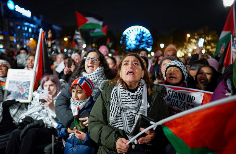  People attend a demonstration in support of Gaza and Palestinians, organised by the Palestine Committee, outside the building of the Norwegian parliament, Stortinget, in Oslo, Norway, November 4, 2023.  (credit: NTB/Heiko Junge via REUTERS)
