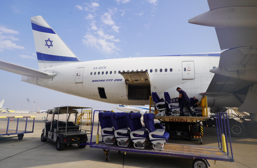  El Al employees remove passenger seats from a Boeing 777, so that the plane can be used to transport cargo to Israel during the ongoing war with Hamas in Gaza. (credit: EL AL on X)