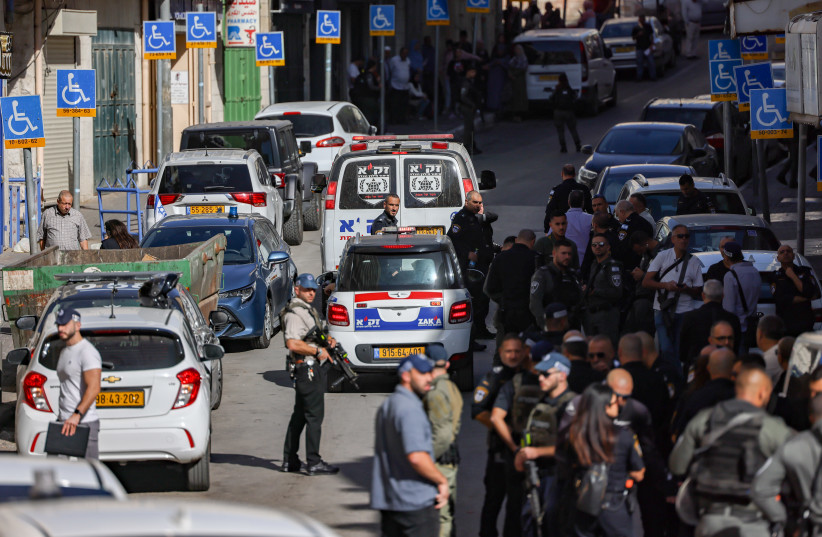  Israeli security forces and rescue forces at the scene of a stabbing attack outside a police station outside Jerusalem Old City, November 6, 2023 (credit: Chaim Goldberg/Flash90)