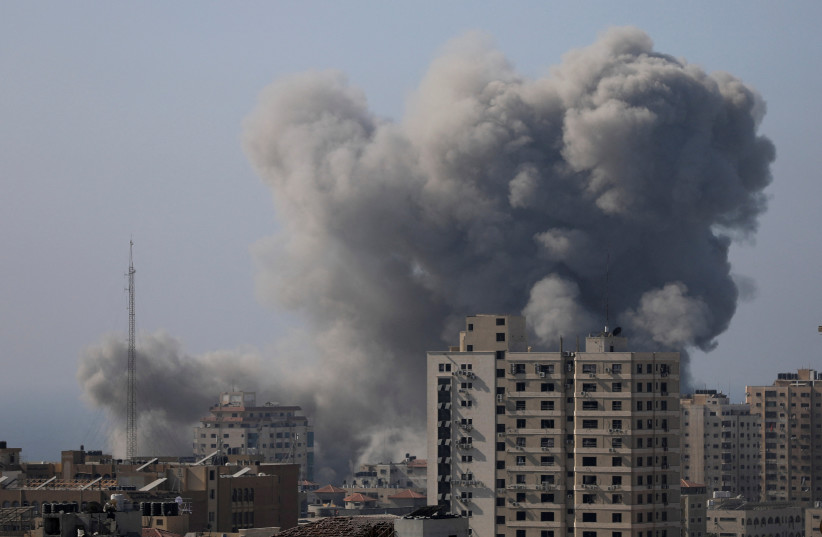  Smoke rises after Israeli strikes, amid the ongoing conflict between Israel and Palestinian Islamist group Hamas, in Gaza City November 6, 2023. (credit: REUTERS/MOHAMMED AL-MASRI)