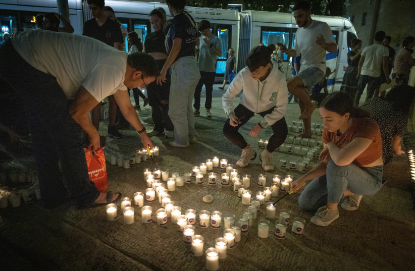  People gather and light candles to remember the victims who were murdered by Hamas terrorists and to remember the people abducted by Hamas terrorists in Jerusalem, November 5, 2023.  (credit: Chaim Goldberg/Flash90)