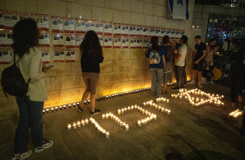  People gather and light candles to remember the victims who were murdered by Hamas terrorists and to remember the people abducted by Hamas terrorists in Jerusalem, November 5, 2023.  (credit: CHAIM GOLDBEG/FLASH90)